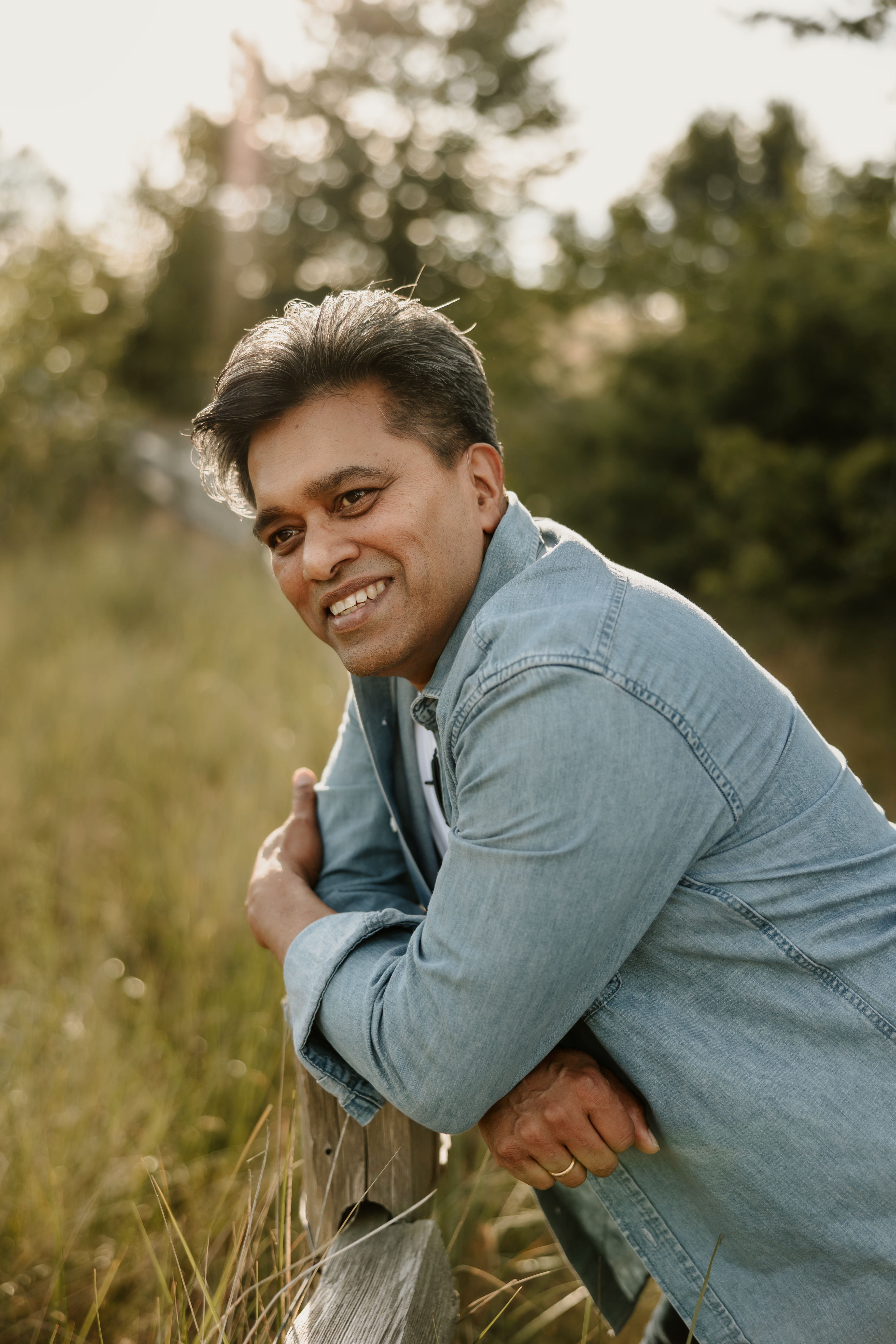 Open book with cursive writing on it in the sunlight with guitar picks.